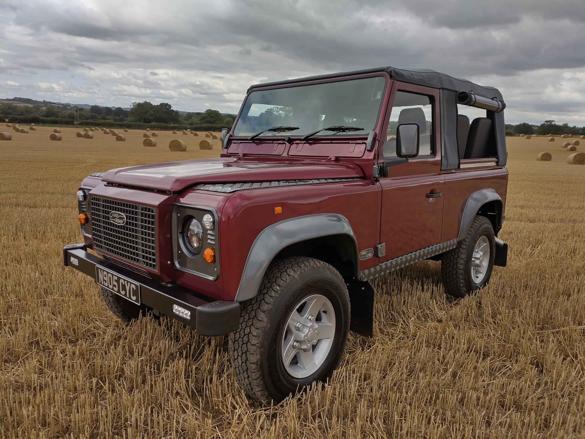red land rover defenders